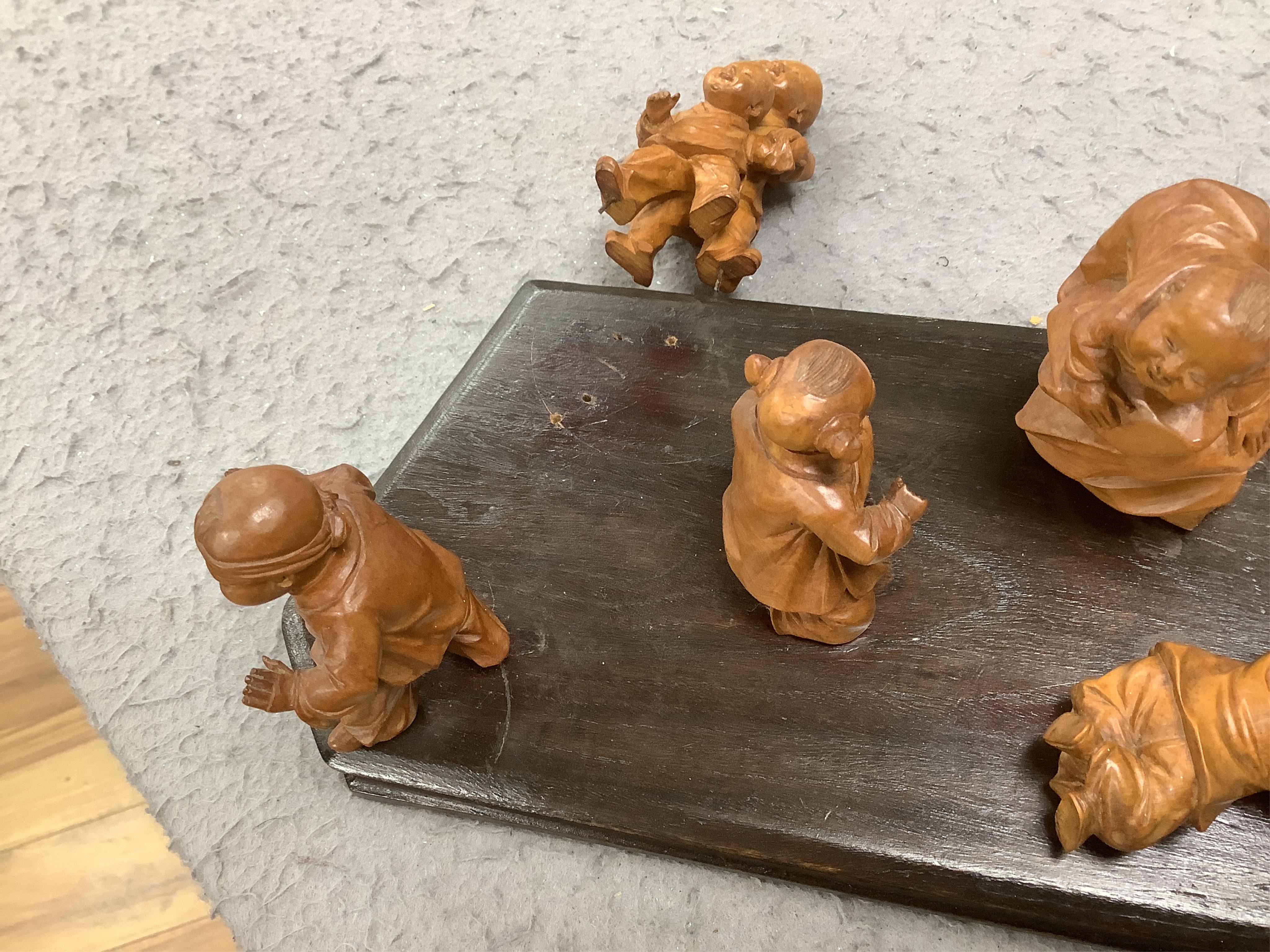 A set five Chinese carved boxwood figures of children playing Blind man’s Buff, Republic period, 23cm wide. Condition - good